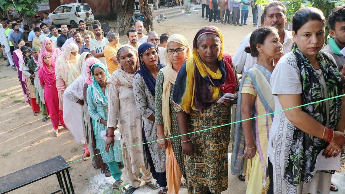 <div class="paragraphs"><p>Women wait in a queue to cast their votes at a polling booth during the third and final phase of Jammu &amp; Kashmir Assembly elections, in Jammu, J&amp;K, Tuesday, October 1, 2024.</p></div>