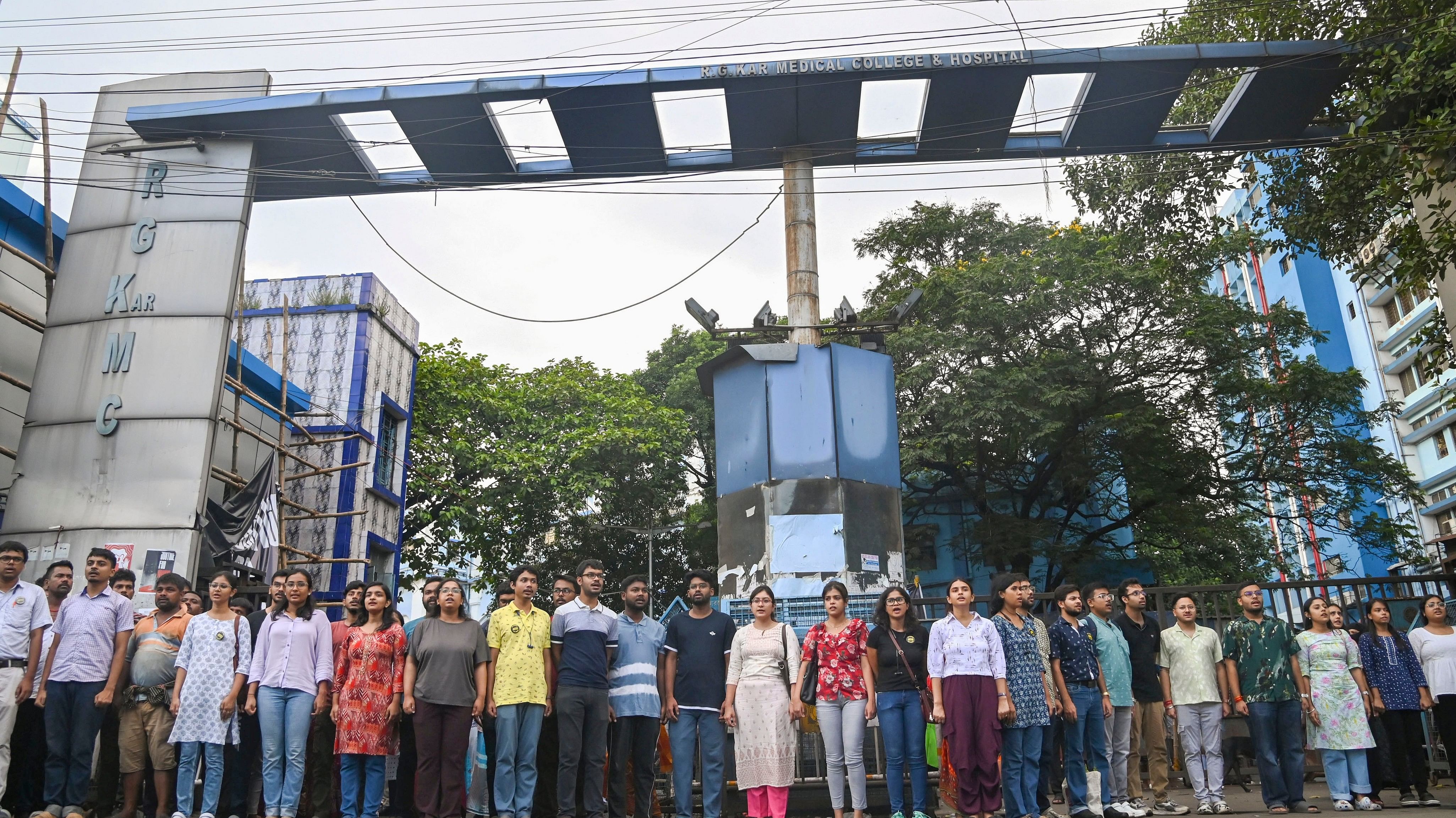 <div class="paragraphs"><p>Kolkata: Junior doctors of RG Kar Medical College &amp; Hospital stage a protest over the alleged sexual assault and murder of a trainee doctor, outside the hospital in Kolkata, Sunday, Sept. 8, 2024. </p></div>