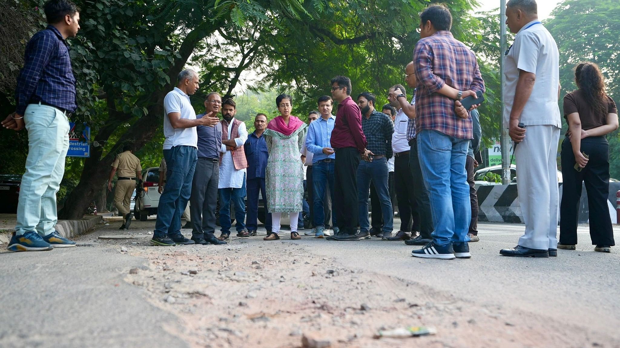 <div class="paragraphs"><p>Atishi inspects roads along with Delhi government officials.</p></div>