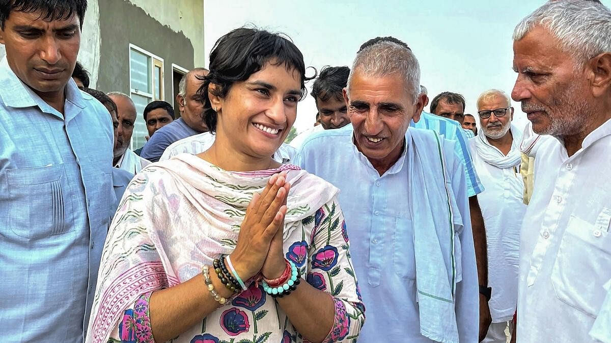 <div class="paragraphs"><p>Wrestler and Congress candidate Vinesh Phogat interacts with people during a rally ahead of Haryana Assembly elections, at Lakhmirwala village in Jind district of Haryana.</p></div>