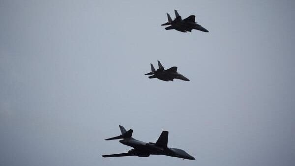 <div class="paragraphs"><p>A U.S. Air Force B1 Bomber flies with South Korean Air Force's F-15K fighter jets during a celebration to mark 76th anniversary of Korea Armed Forces Day, in Seongnam, South Korea.&nbsp;</p></div>