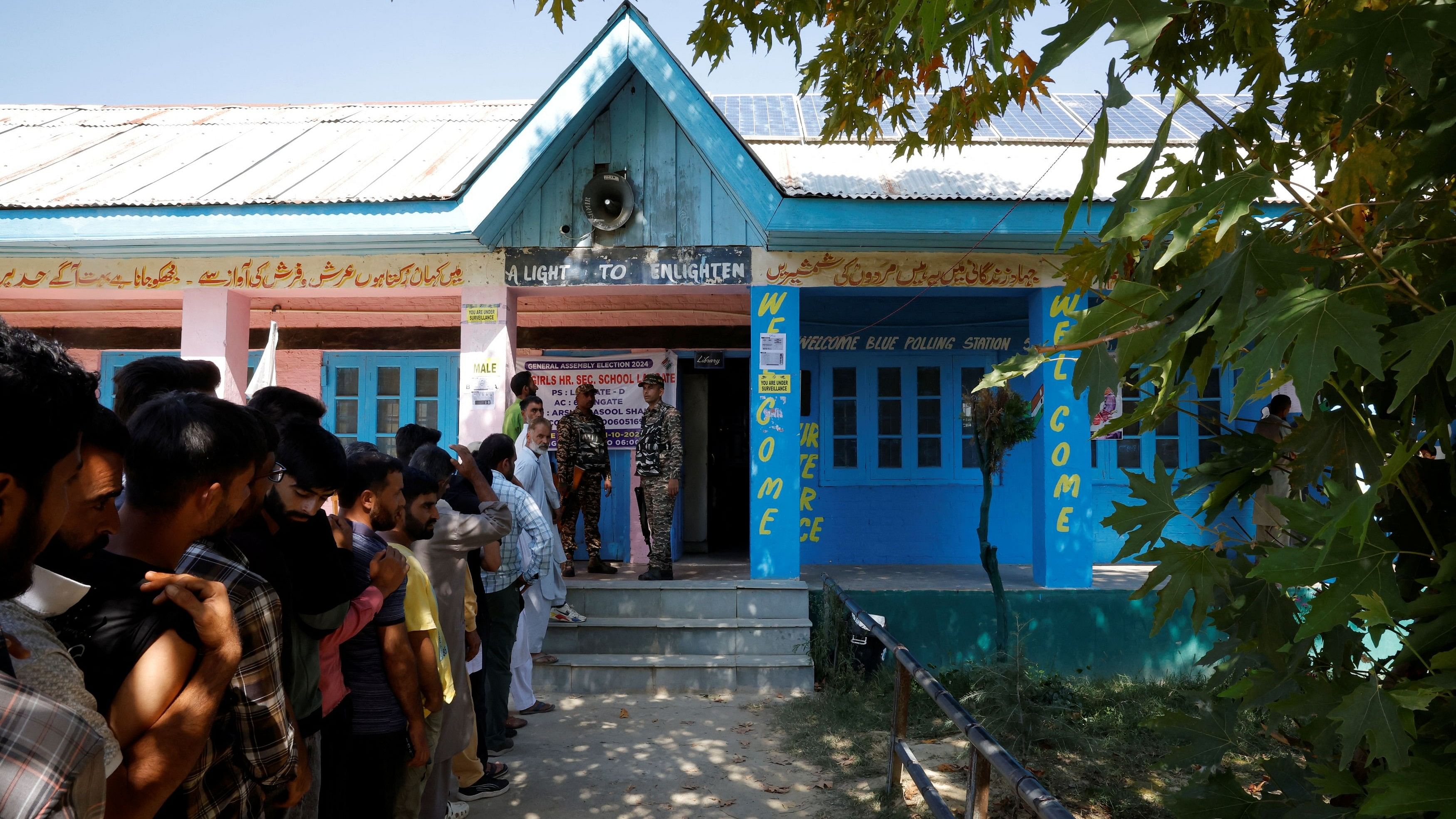 <div class="paragraphs"><p>People queue to vote at a polling station, during the third and final phase of assembly elections, in North Kashmir's Handwara, October 1, 2024.</p></div>