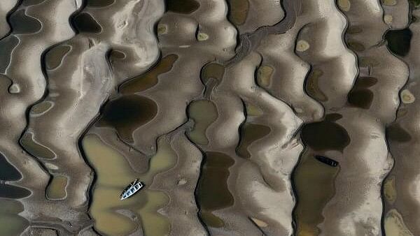 <div class="paragraphs"><p>A drone view shows stranded boats over the sandbanks exposed due to drought at the Solimoes River, one of the largest tributaries of the Amazon River, during the most intense and widespread drought Brazil has experienced since records began in 1950, near Manacapuru, Amazonas state, Brazil.</p></div>