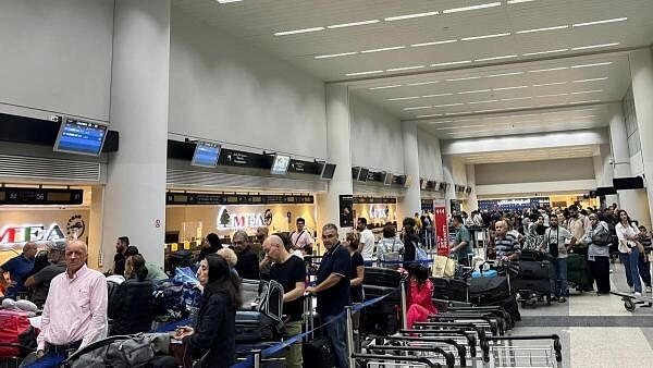 <div class="paragraphs"><p>Passengers queue at the check-in counters at Beirut-Rafic Al Hariri International Airport, in Beirut, Lebanon on October 2, 2024. </p></div>