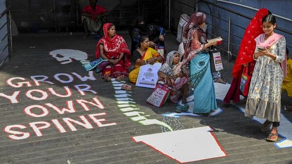 <div class="paragraphs"><p>A graffiti made by junior doctors as family members of patients wait near the Out Patient Department (OPD) at RG Kar Medical College and Hospital during the 'total cease work' by agitating junior doctors in West Bengal demanding that the state government address various issues, including the need for enhanced safety and security in hospitals, in Kolkata.</p></div>