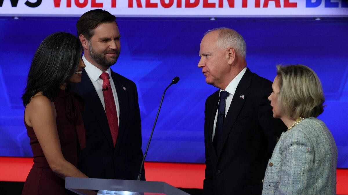 <div class="paragraphs"><p>Democratic vice presidential nominee Minnesota Governor Tim Walz, and his wife Gwen, and Republican vice presidential nominee U.S. Senator JD Vance, and his wife Usha, speak at the end of the Vice Presidential debate hosted by CBS in New York, U.S., October 1, 2024.</p></div>