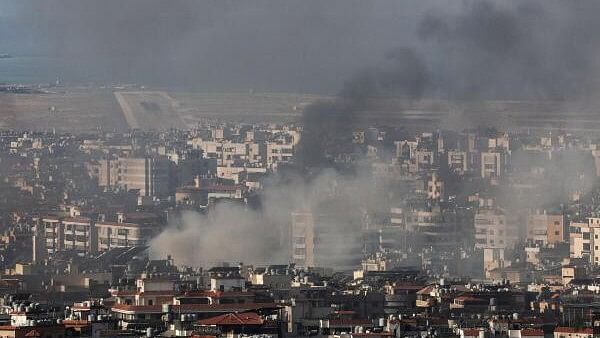 <div class="paragraphs"><p>Smoke blankets the sky over the runway of Beirut-Rafic Hariri International Airport and Beirut's southern suburbs after a strike, amid the ongoing hostilities between Hezbollah and Israeli forces</p></div>