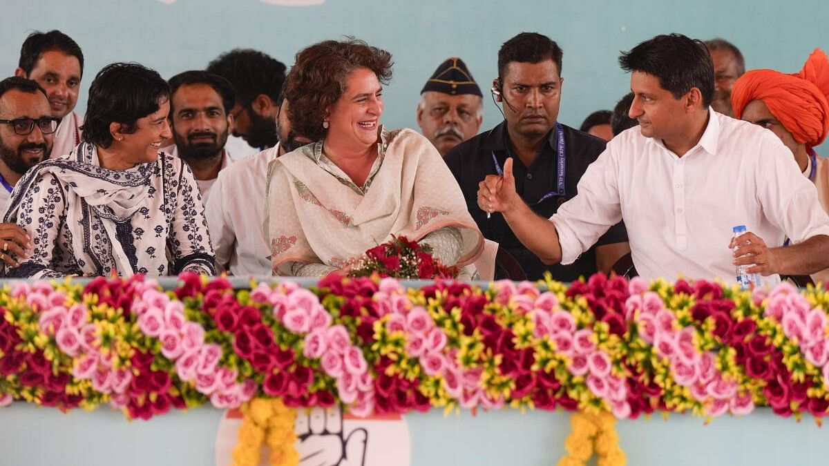 <div class="paragraphs"><p>Priyanka Gandhi, flanked by Vinesh Phogat (left) and&nbsp; Deepender Hooda during the party's Haryana Vijay Sankalp Jansabha in Julana.</p></div>