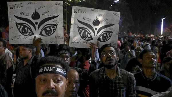 <div class="paragraphs"><p>eople take part in a protest rally under the banner of Joint Platform of Doctors, against the alleged sexual assault and murder of a trainee doctor at RG Kar Medical College and Hospital, in Kolkata.</p></div>