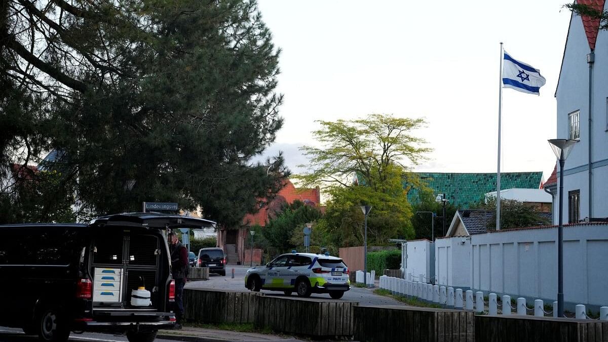 <div class="paragraphs"><p>A police vehicle is seen as police officers investigate two blasts near the Israeli embassy in Copenhagen, Denmark.</p></div>