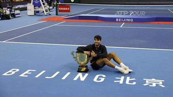 <div class="paragraphs"><p>China Open - China National Tennis Center, Beijing - Spain's Carlos Alcaraz celebrates with the trophy after winning his final match against Italy's Jannik Sinner.</p></div>