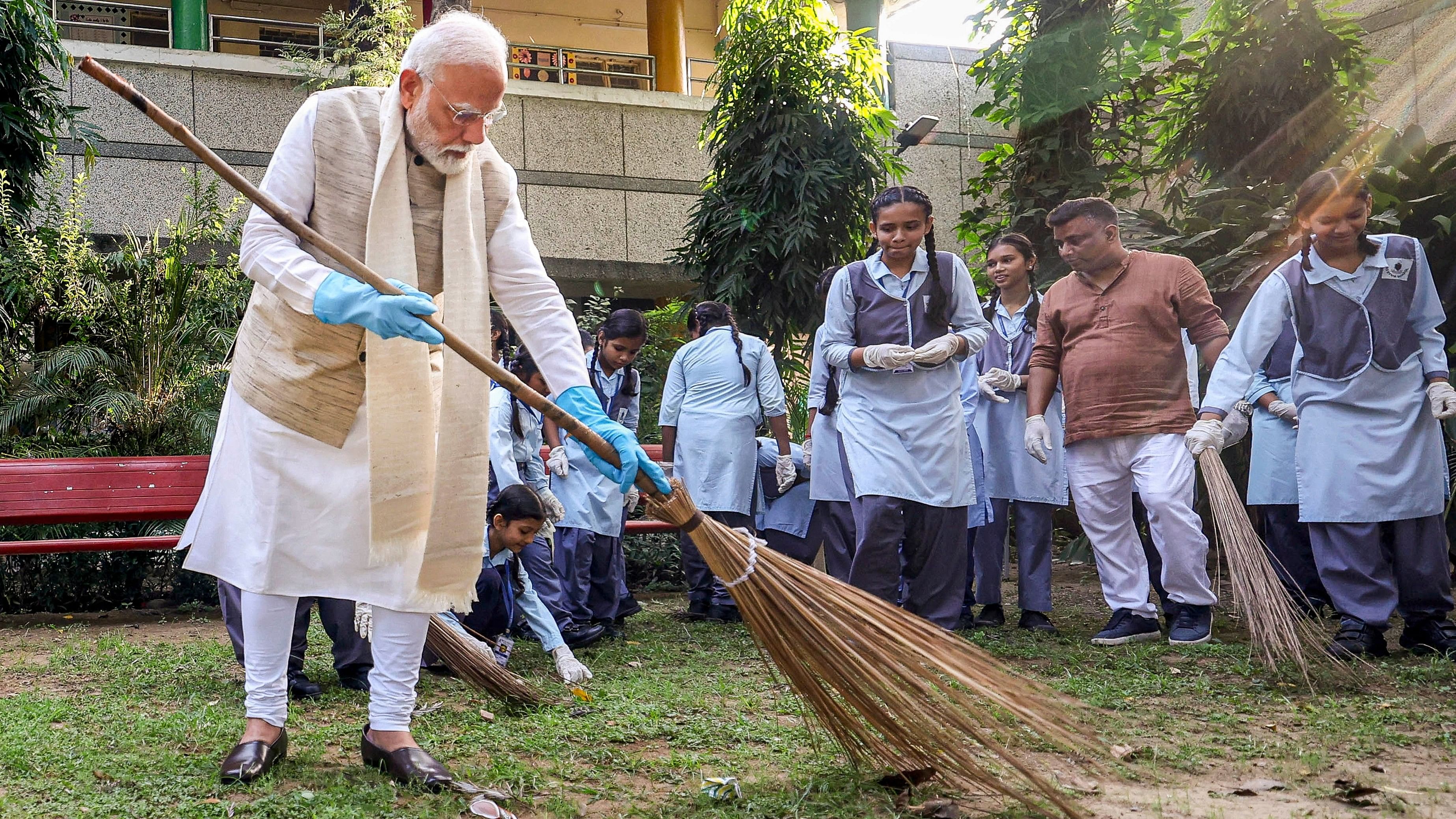 <div class="paragraphs"><p>rime Minister Narendra Modi takes part in a cleanliness drive at a school on the ocassion of Gandhi Jayanti.</p></div>