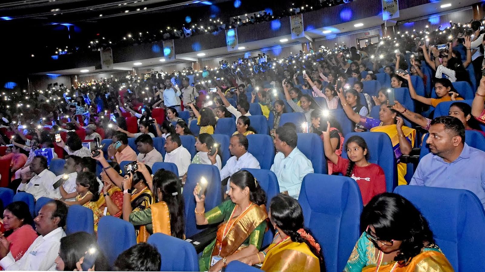 <div class="paragraphs"><p>Audience sway mobile flash lights as the Kannada song 'Gombe Helutaite' played during the film festival, in Mysuru, on Thursday.</p></div>