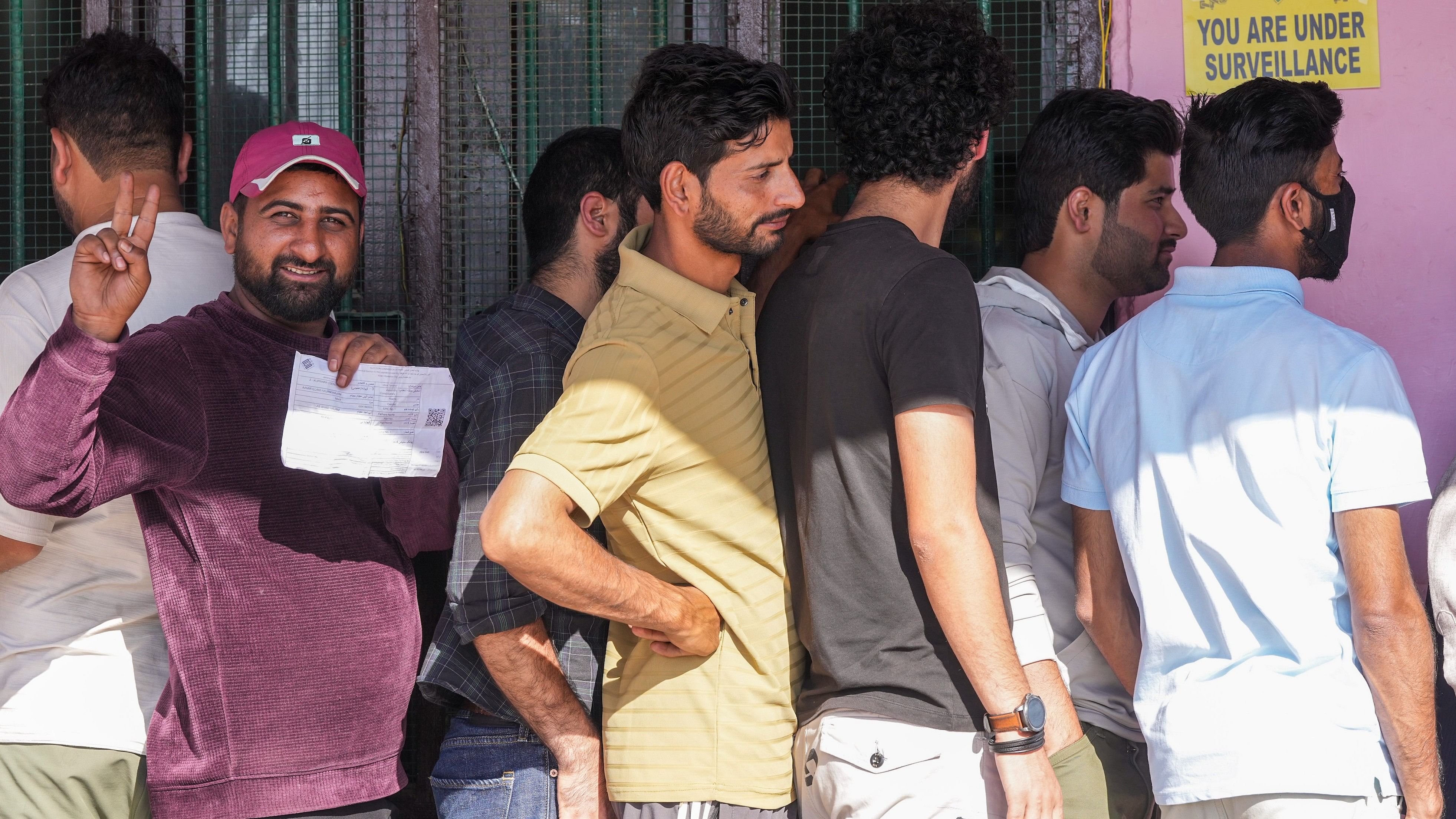 <div class="paragraphs"><p>Voters stand in a queue to cast votes at a polling station during the third and final phase of J&amp;K Assembly elections, at Handwara in Kupwara district of North Kashmir, Tuesday, Oct 1, 2024.</p></div>