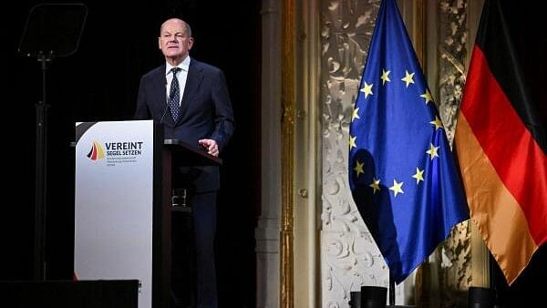 <div class="paragraphs"><p>German Chancellor Olaf Scholz speaks during a ceremony to mark the 34th anniversary of Germany's Unification Day, at Mecklenburg State Theatre in Schwerin, Germany October 3, 2024. </p></div>