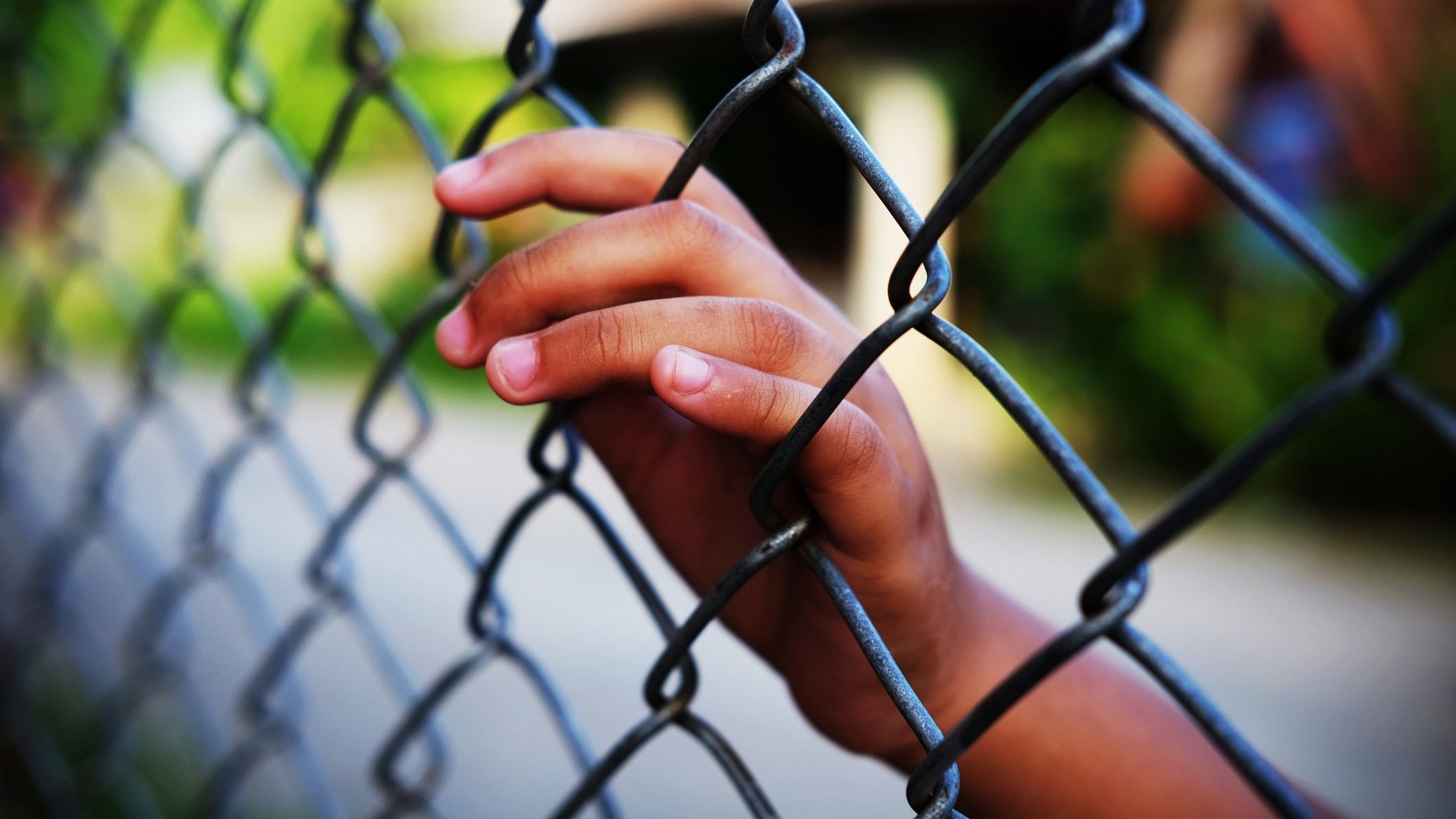 <div class="paragraphs"><p>Image showing a child holing a fence. For representational purposes.</p></div>