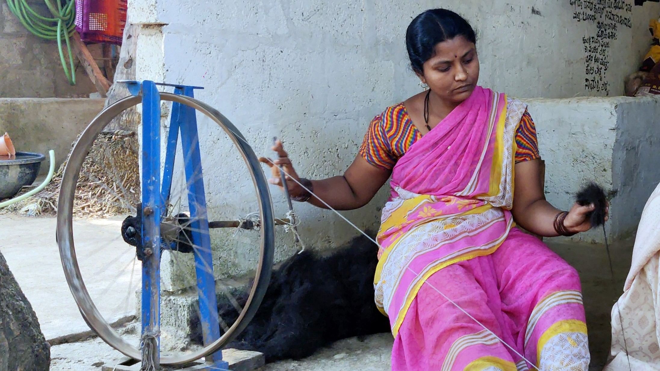 <div class="paragraphs"><p>A woman spins yarn in Haveri; kambali makers display the finished product. </p></div>