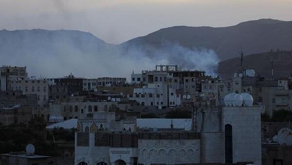 <div class="paragraphs"><p>Smoke rises from the site of strikes in Sanaa, Yemen.</p></div>