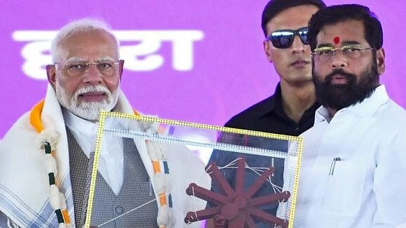 <div class="paragraphs"><p>File photo of Prime Minister Narendra Modi (L) being felicitated by Maharashtra Chief Minister Eknath Shinde.</p></div>