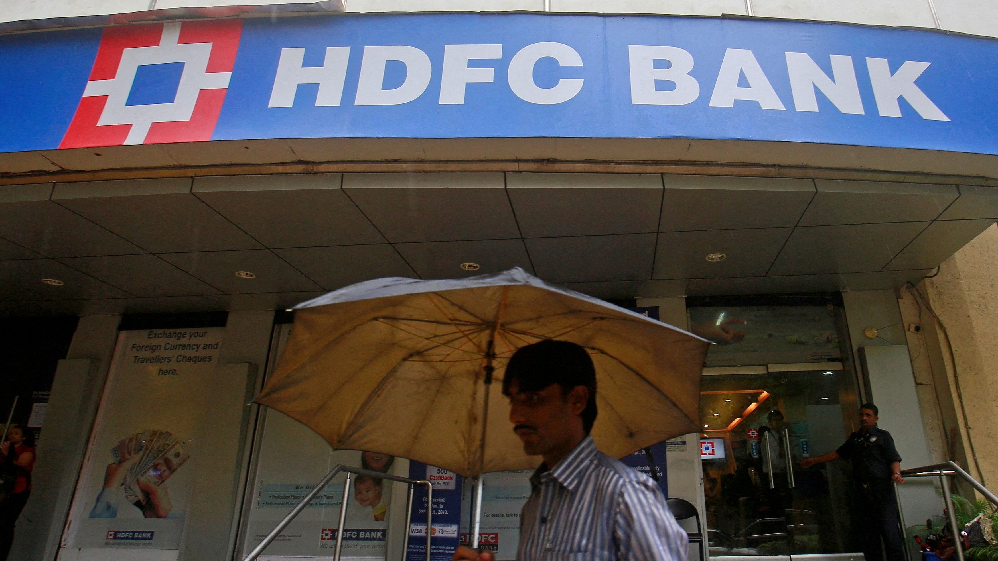 <div class="paragraphs"><p>A customer walks outside an HDFC Bank branch in Mumbai.</p></div>