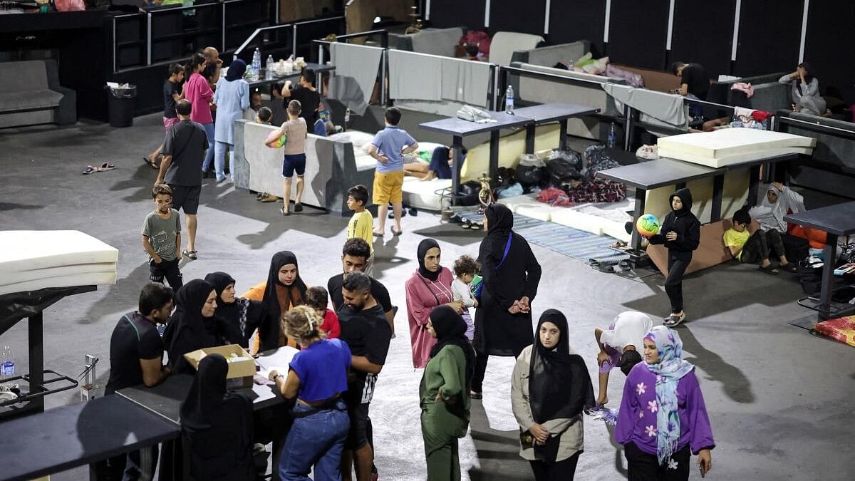 <div class="paragraphs"><p>Displaced families walk in the famous Skybar club, which became a shelter for the displaced who fled, amid ongoing hostilities between Hezbollah and Israeli forces in Beirut’s southern suburbs and its surroundings, in Beirut, Lebanon.</p></div>