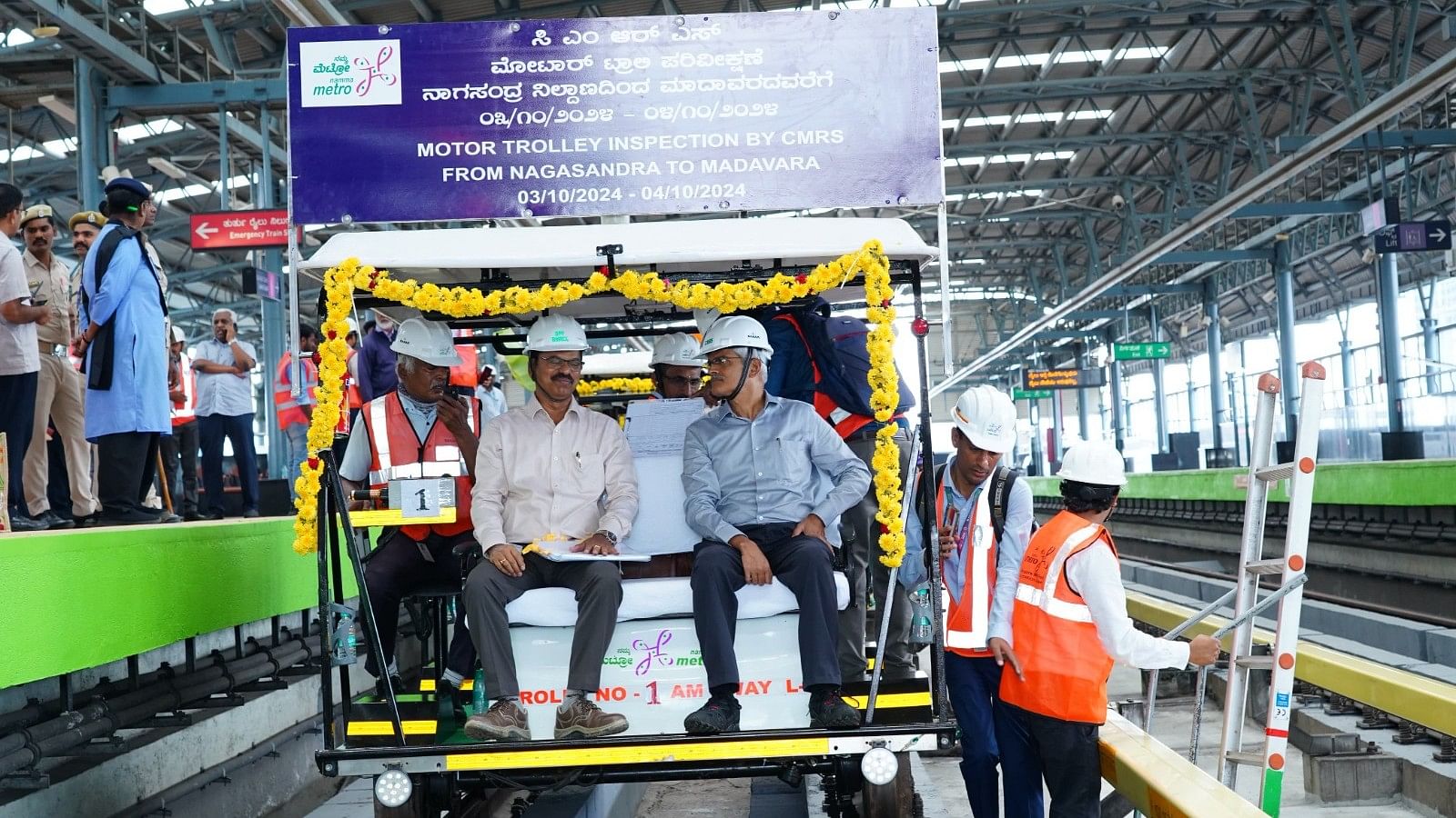 <div class="paragraphs"><p>Commissioner for Metro Railway Safety (Southern Circle), A M Chowdhary, during a motor trolley inspection of Namma Metro's Nagasandra-Madavara line on October 3, 2024.</p></div>