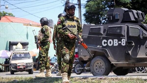 <div class="paragraphs"><p>Kenyan police officers patrol as the country is facing emergency food insecurity while immersed in a social and political crisis, in Port-au-Prince, Haiti October 3, 2024. </p></div>