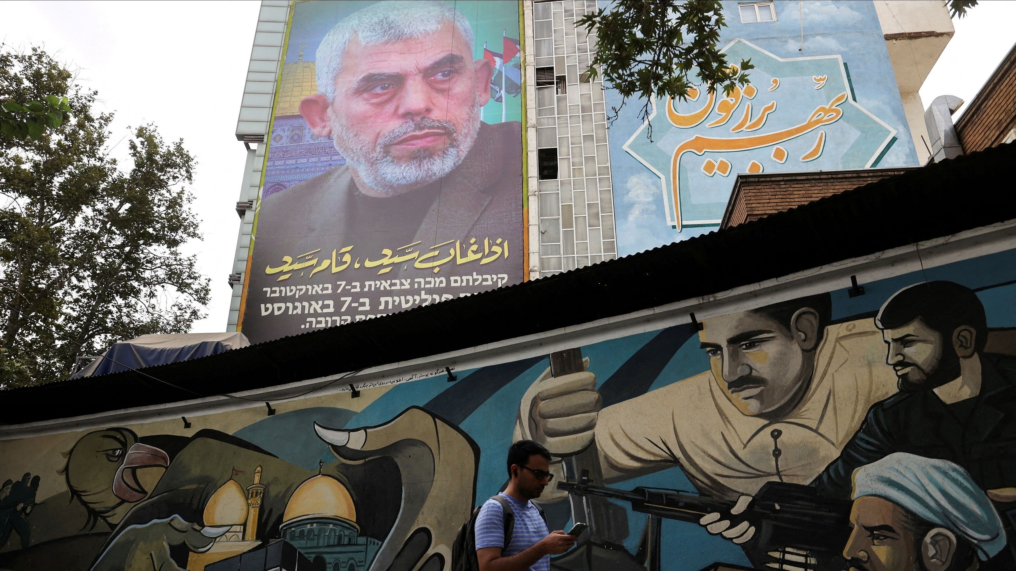 <div class="paragraphs"><p> A billboard with a picture of newly appointed Hamas leader Yahya Sinwar is displayed on a building in a street in Tehran, Iran.</p></div>