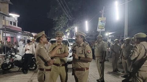 <div class="paragraphs"><p>Police personnel investigate after four members of a family were shot dead at their home, in Amethi.</p></div>