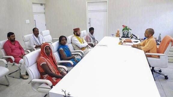 <div class="paragraphs"><p>Uttar Pradesh Chief Minister Yogi Adityanath meets family members of the person who was killed in Amethi, at his official residence in Lucknow, Saturday, Oct. 5, 2024. </p></div>