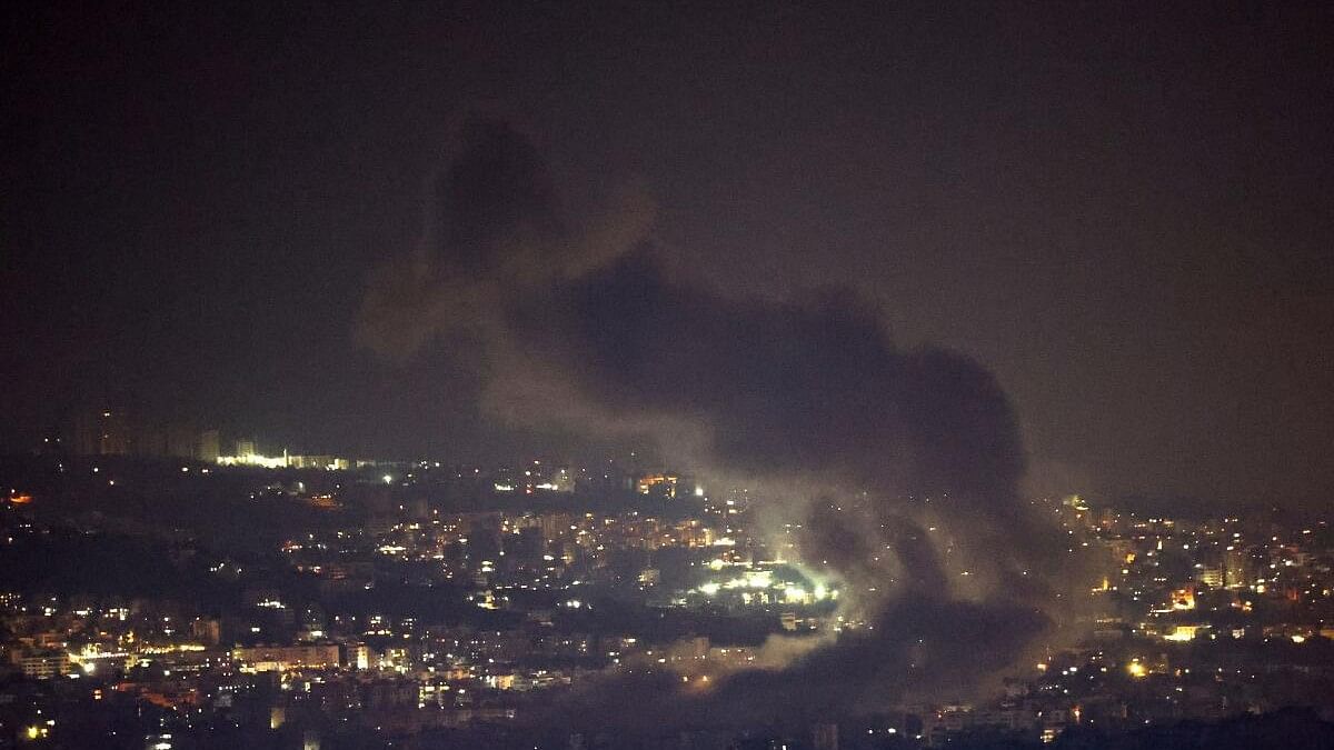 <div class="paragraphs"><p>Smoke billows over Beirut's southern suburbs after a strike, amid ongoing hostilities between Hezbollah and Israeli forces.</p></div>