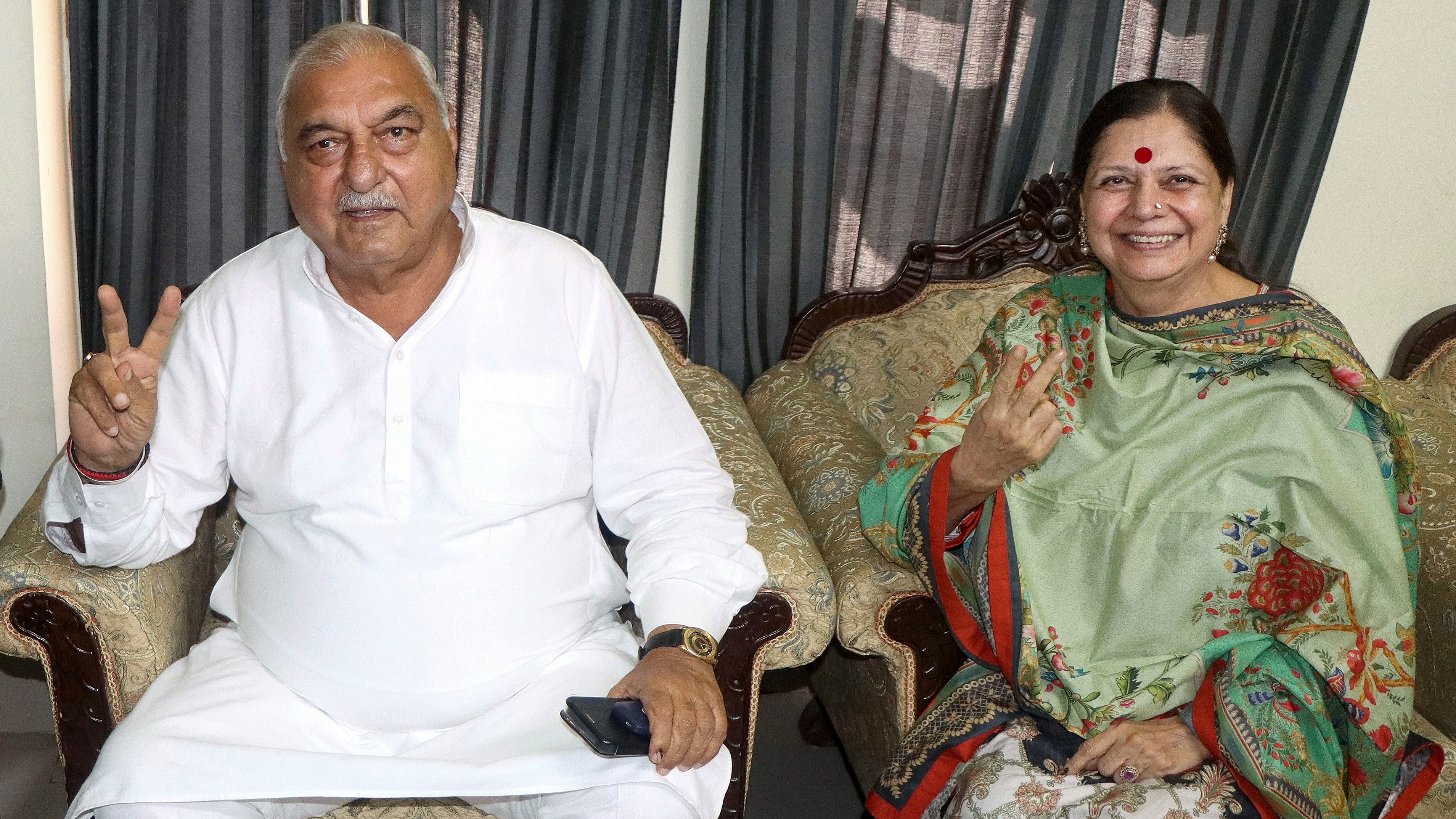 <div class="paragraphs"><p>Haryana Assembly Leader of Opposition Bhupinder Singh Hooda with his wife Asha Hooda, at his residence in Rohtak, Sunday.</p></div>