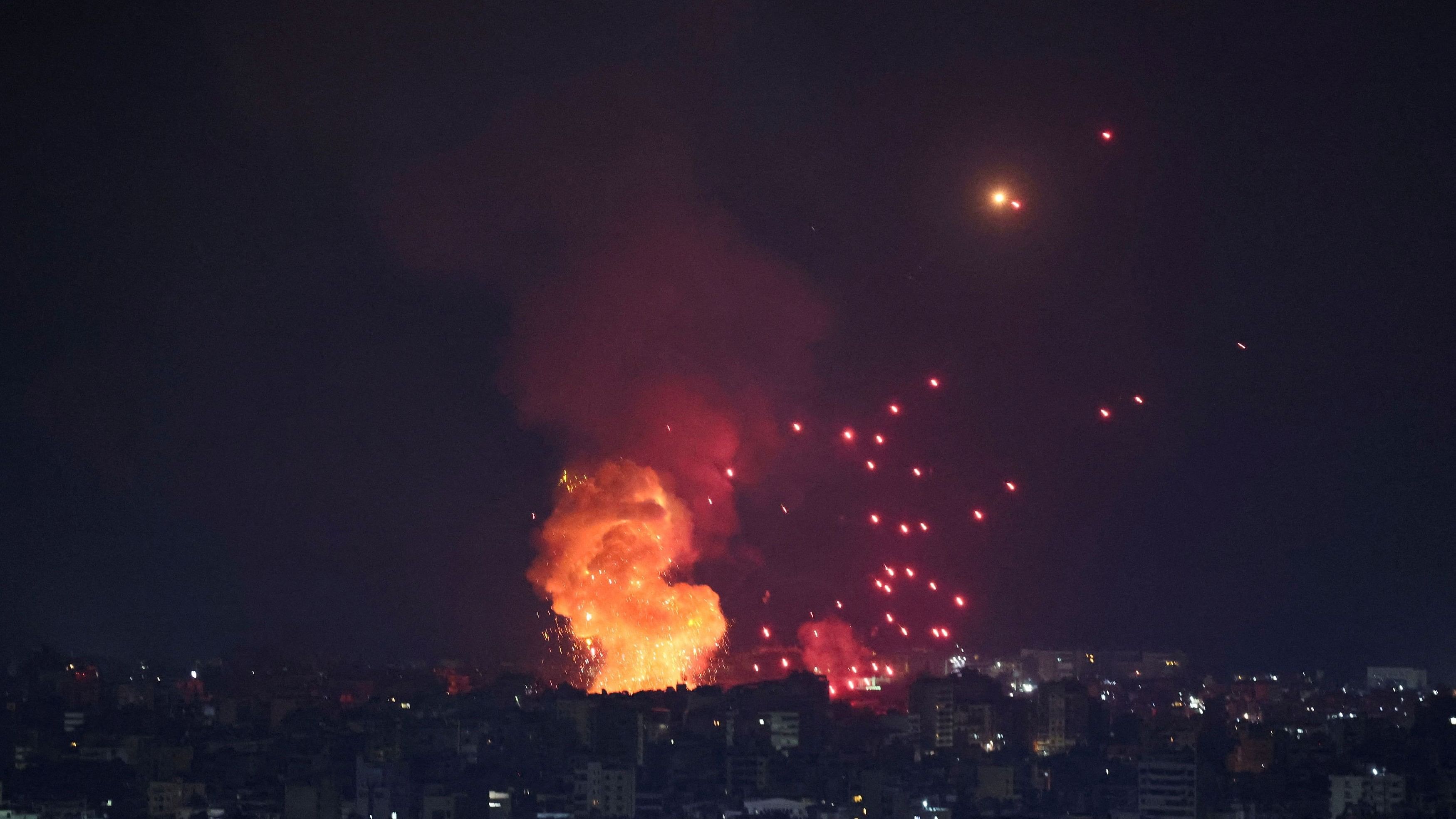 <div class="paragraphs"><p>Smoke and flames rise over Beirut's southern suburbs after a strike, amid ongoing hostilities between Hezbollah and Israeli forces, as seen from Sin El Fil, Lebanon, October 6, 2024.</p></div>