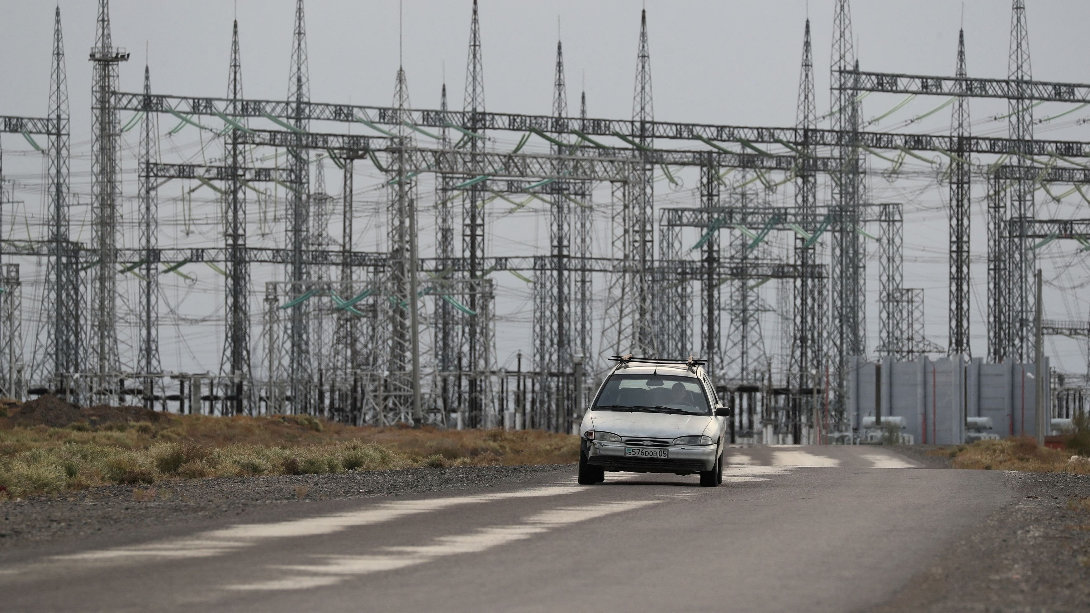 <div class="paragraphs"><p>A car drives near an electrical substation outside the village of Ulken on the eve of the referendum on the construction of a nuclear power plant, in the Almaty Region, Kazakhstan.</p></div>