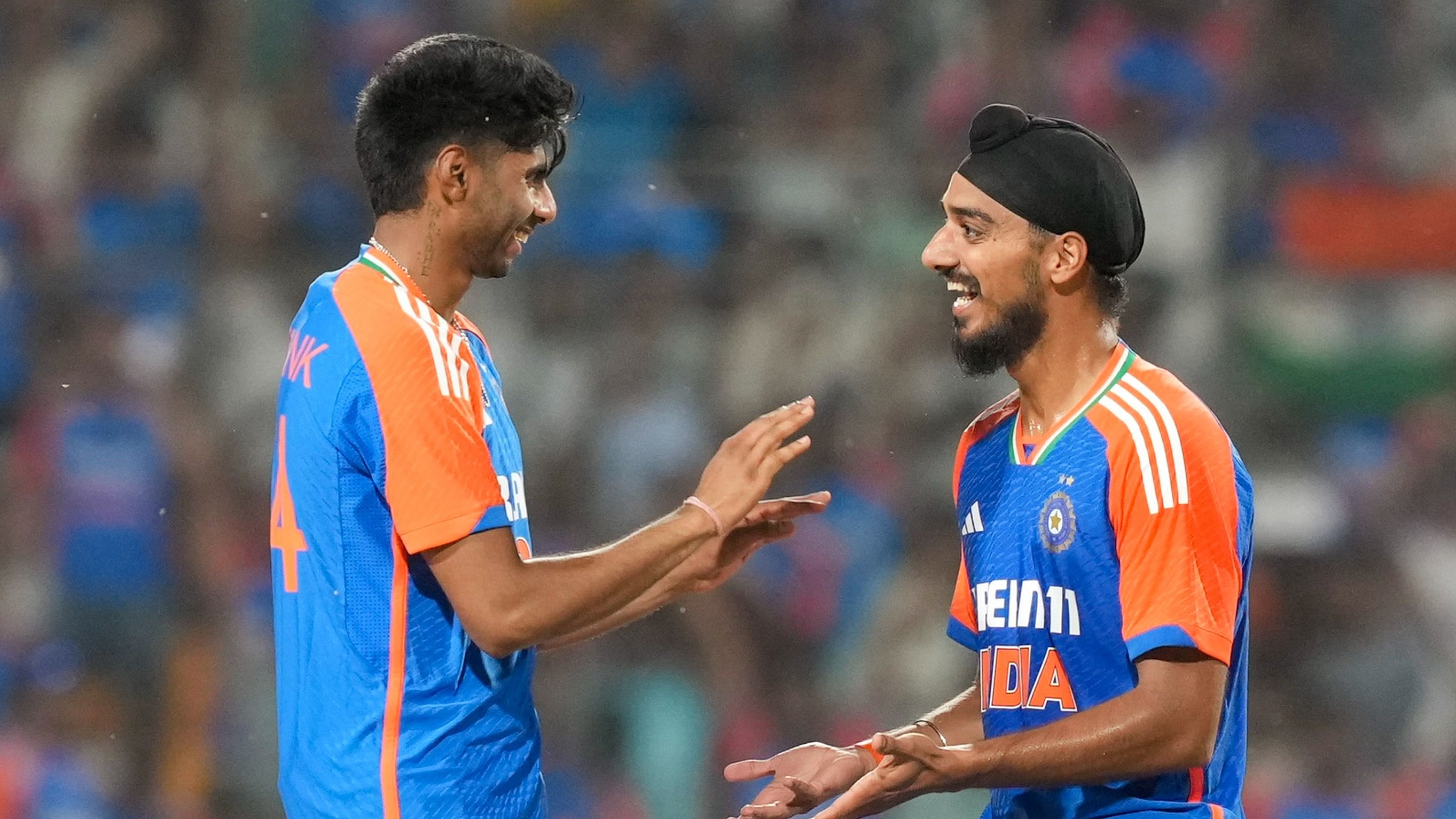 <div class="paragraphs"><p>Mayank Yadav with Arshdeep Singh after taking the wicket of Bangladesh's Mahmudullah</p></div>