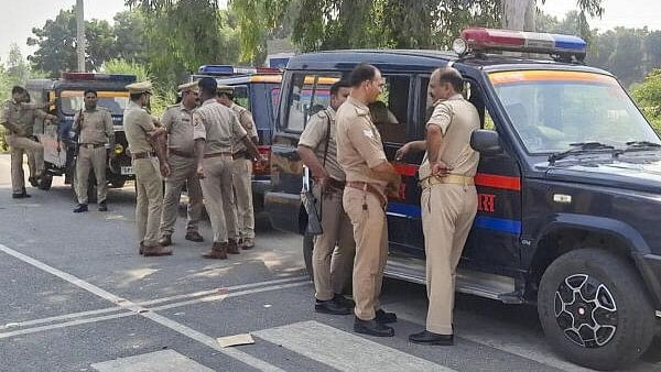 <div class="paragraphs"><p>Police personnel stand guard after a protest over the Yati Narsinghanand’s statement, in Saharanpur, Uttar Pradesh, Sunday, Oct. 6, 2024.</p></div>