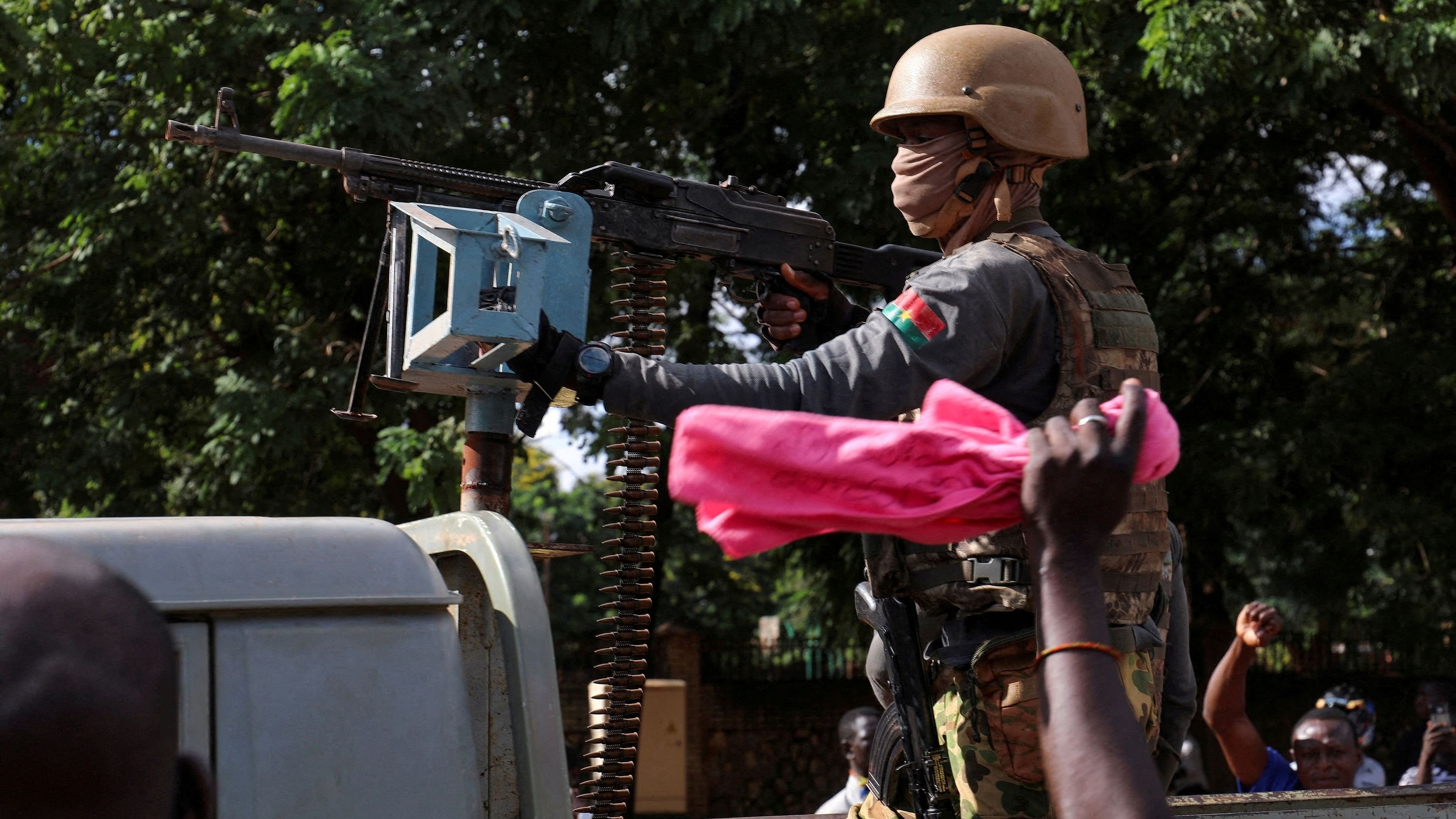 <div class="paragraphs"><p>New junta's soldiers stand guard in an armoured vehicle in Ouagadougou, Burkina Faso.&nbsp;</p></div>