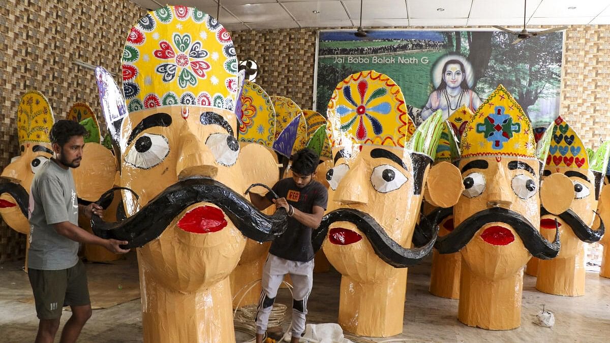 <div class="paragraphs"><p>Worker makes effigy of King Ravana as part of Dussehra festival celebrations.&nbsp;&nbsp;</p></div>