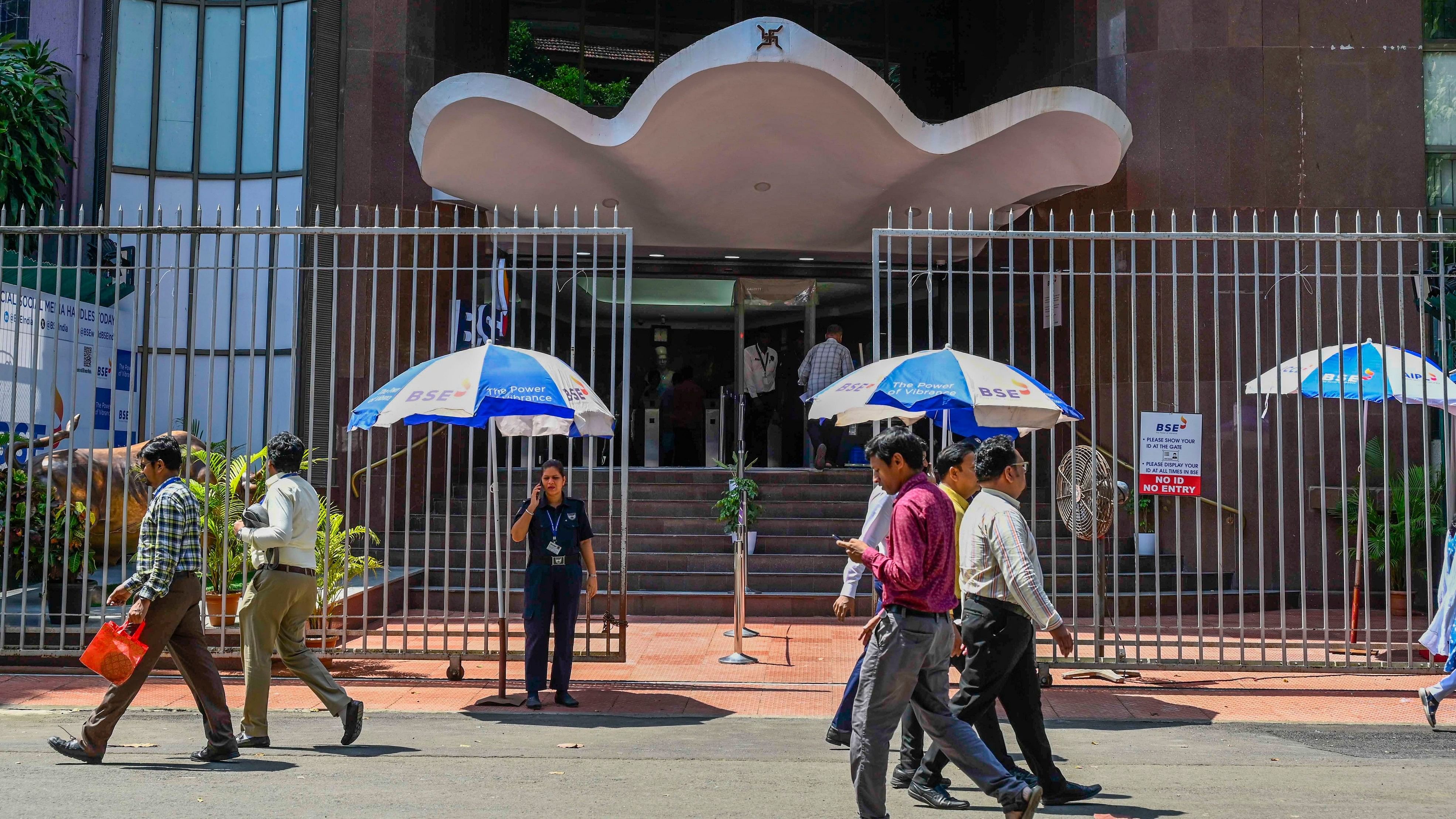 <div class="paragraphs"><p>People walk past the Bombay Stock Exchange building in Mumbai.</p></div>