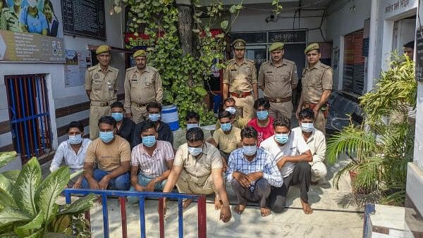 <div class="paragraphs"><p>Police show 13 people arrested for being allegedly involved in pelting stones at the police during a protest seeking action against Mahant Yati Narsinghanand in Sheikhpura Qadeem, in police custody in Saharanpur district, Monday, Oct. 7, 2024.</p></div>