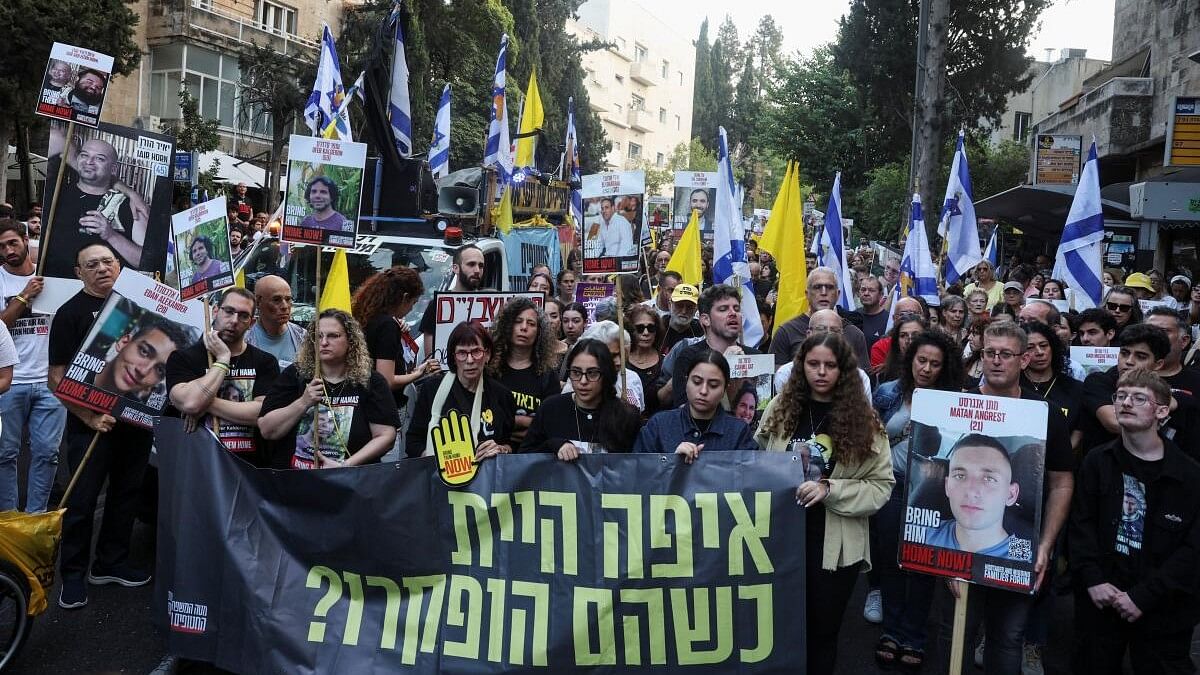 <div class="paragraphs"><p>Protesters march towards Israeli Prime Minister Benjamin Netanyahu's private residence, to mark one year since the deadly October 7 attack by Hamas, in Jerusalem, October 7, 2024.</p></div>