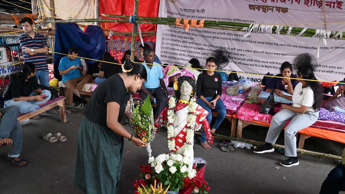 <div class="paragraphs"><p>Junior doctors sit on fast to protest over the alleged rape and murder of a trainee doctor at the RG Kar Medical College and Hospital, in Kolkata</p></div>