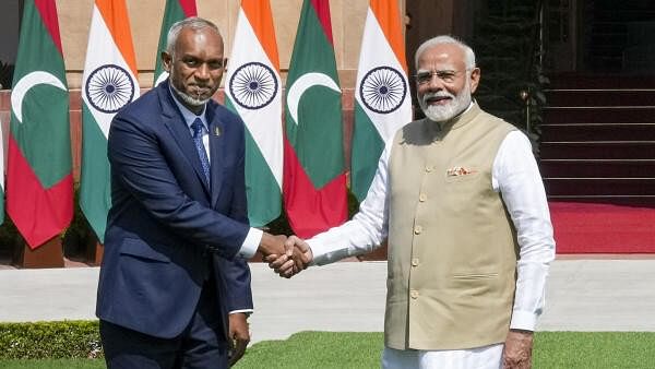 <div class="paragraphs"><p>Prime Minister Narendra Modi shakes hands with Maldives President Mohamed Muizzu prior to a meeting at Hyderabad House, in New Delhi.&nbsp;</p></div>