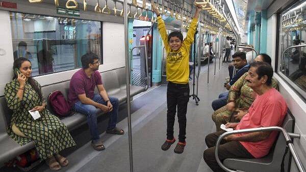 <div class="paragraphs"><p>Mumbai: People ride a metro on the Bandra Kurla Complex (BKC) to Aarey underground section of Mumbai Metro Line 3 after it was opened for public, in Mumbai, Monday, Oct. 7, 2024.</p></div>