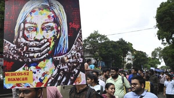 <div class="paragraphs"><p>Junior doctors take part in a protest rally against the alleged sexual assault and murder of a postgraduate trainee doctor at R G Kar Medical College and Hospital, in Kolkata</p></div>