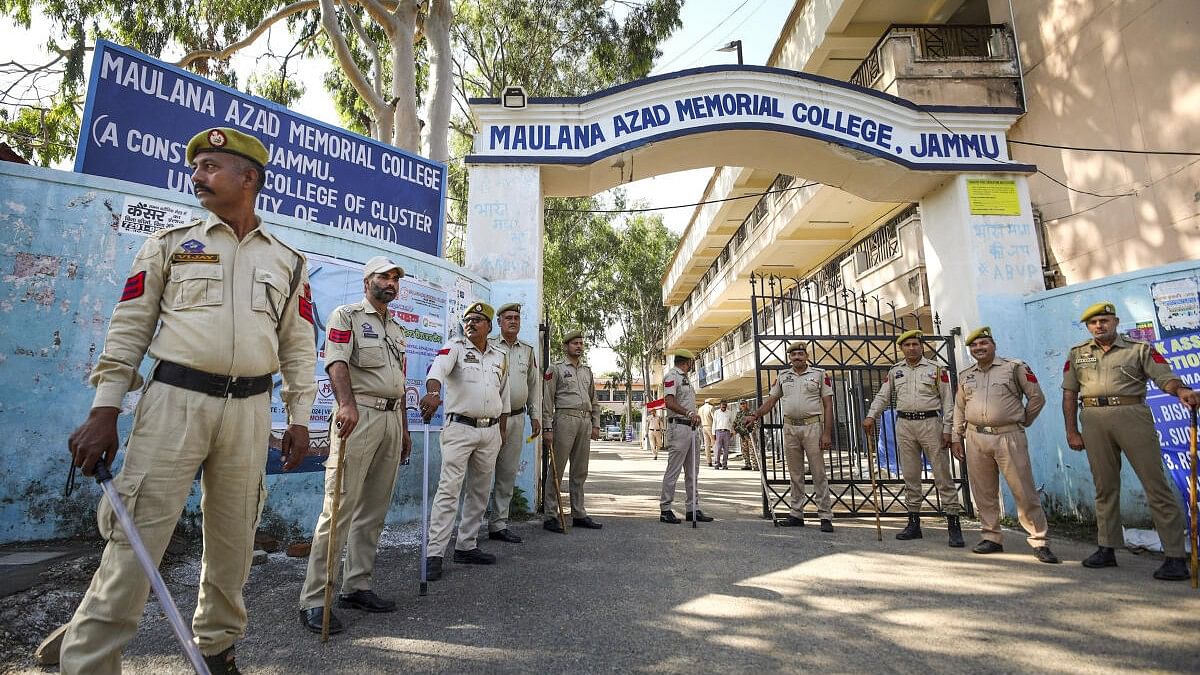 <div class="paragraphs"><p>Security personnel stand guard outside a counting centre, a day before the counting of votes for Jammu &amp; Kashmir Assembly elections, in Jammu, Monday, Oct. 7, 2024.</p></div>