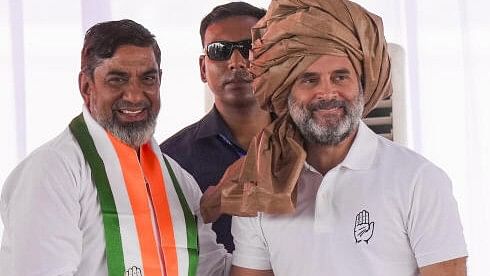 <div class="paragraphs"><p>Congress leader Rahul Gandhi being felicitated by party candidate from Nuh constituency Aftab Ahmed during the party's public meeting 'Haryana Vijay Sankalp Jansabha'.&nbsp;</p></div>