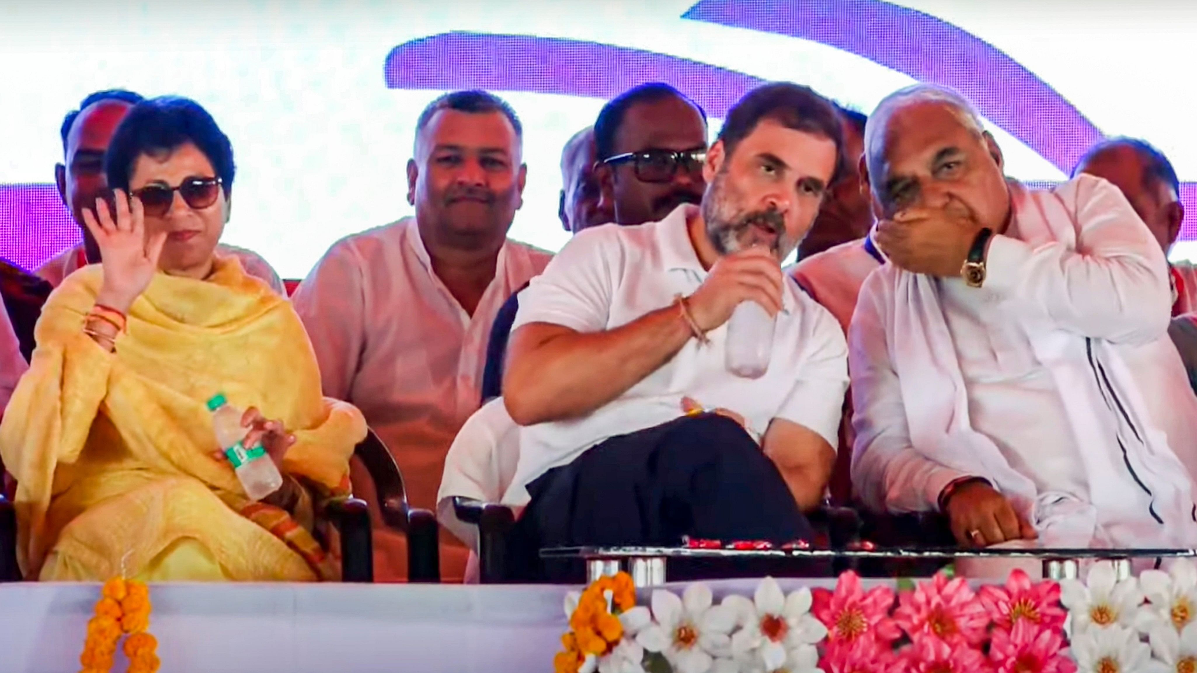 <div class="paragraphs"><p> Leader of Oppostion in Lok Sabha and Congress leader Rahul Gandhi with party leaders Bhupinder Singh Hooda and Kumari Selja during a public meeting for Haryana Assembly elections, at Assandh, in Karnal district, Haryana.&nbsp;</p></div>