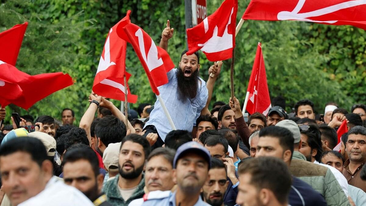 <div class="paragraphs"><p>Supporters of Jammu and Kashmir National Conference shout slogans as they celebrate outside a vote counting centre.</p></div>