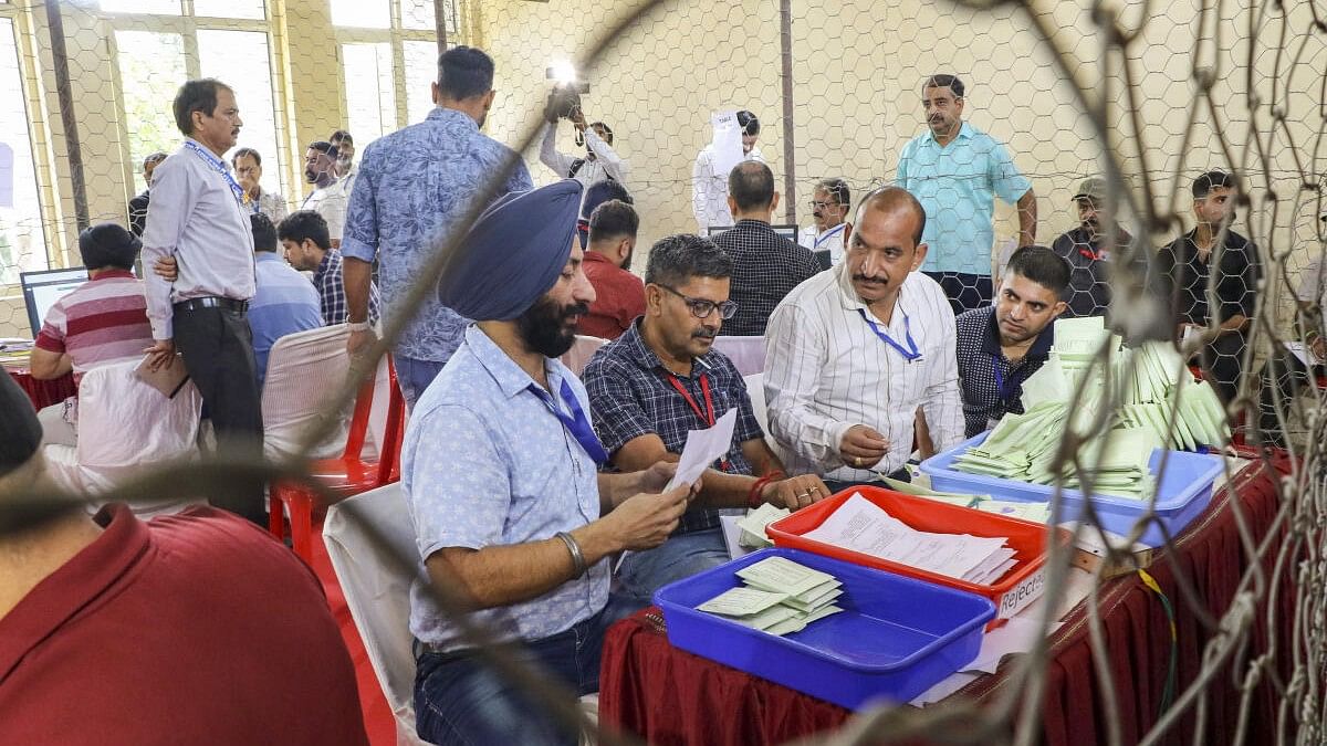 <div class="paragraphs"><p>Election officials carry out counting of votes for the Jammu &amp; Kashmir Assembly elections, at Polytechnic College counting centre in Jammu on Tuesday, October 8, 2024.</p></div>